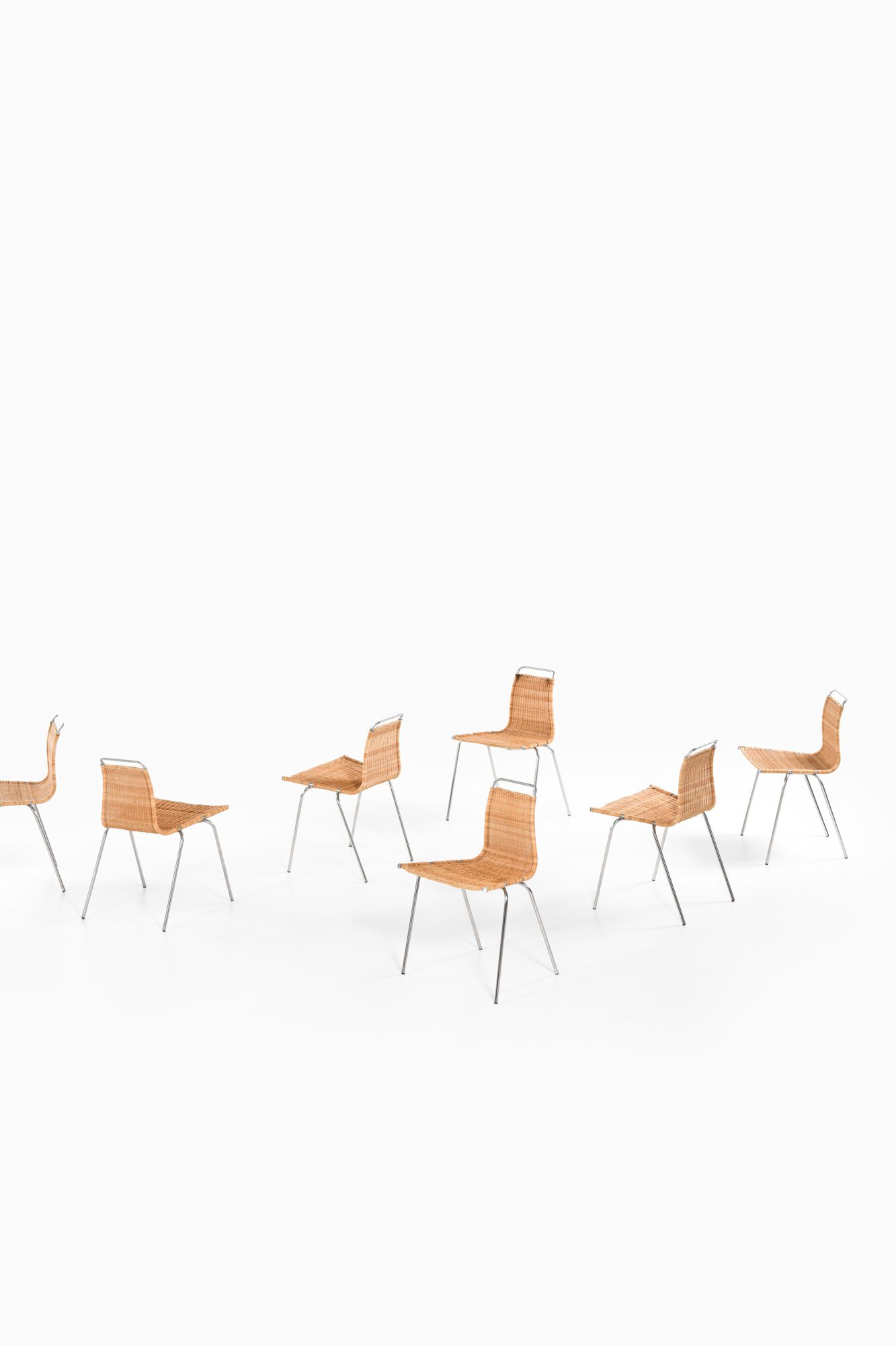 Poul Kjærholm PK-1 dining chairs at Studio Schalling