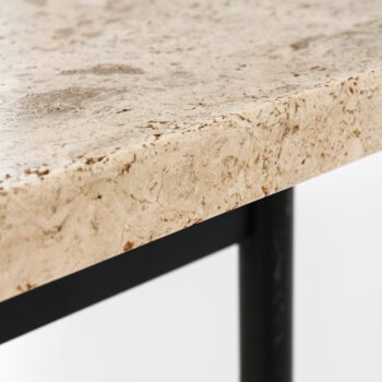 Coffee table with travertine top at Studio Schalling