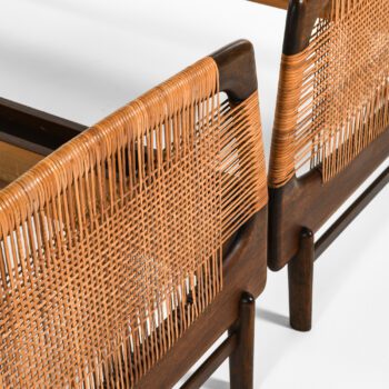 Bed frames in walnut and woven cane at Studio Schalling