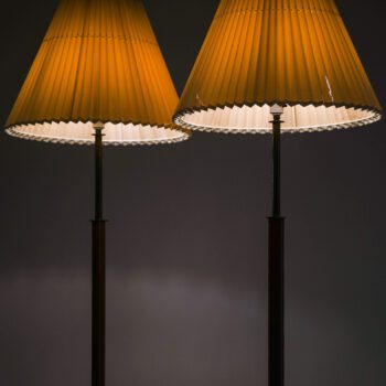Philips floor lamps in brass and leather at Studio Schalling