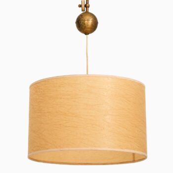 Height adjustable ceiling lamp in brass at Studio Schalling