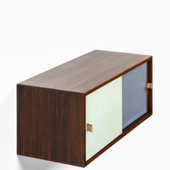 Wall mounted cabinet in rosewood at Studio Schalling