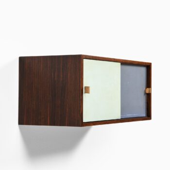 Wall mounted cabinet in rosewood at Studio Schalling