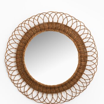 Round mirror in rattan at Studio Schalling