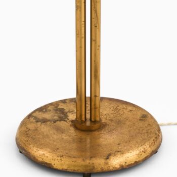 Height adjustable floor lamp in brass at Studio Schalling