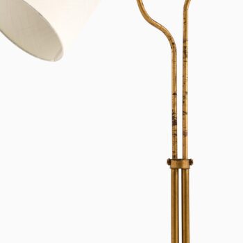 Height adjustable floor lamp in brass at Studio Schalling