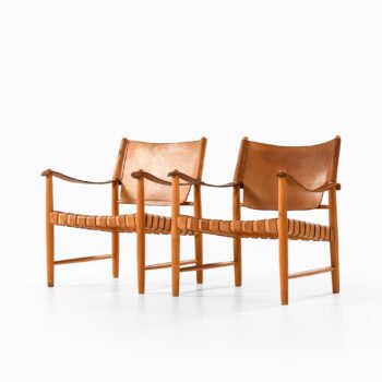 Easy chairs in beech and leather at Studio Schalling