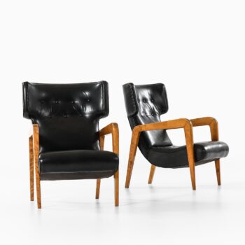 Easy chairs in birch and leather at Studio Schalling