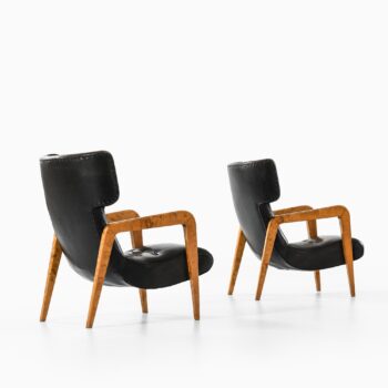 Easy chairs in birch and leather at Studio Schalling