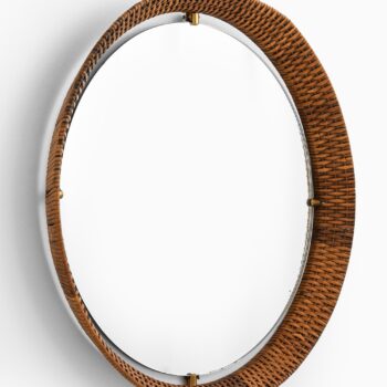 Round mirror in brass and cane at Studio Schalling
