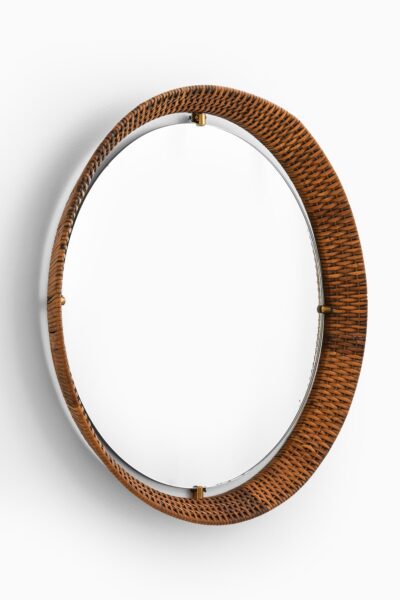Round mirror in brass and cane at Studio Schalling