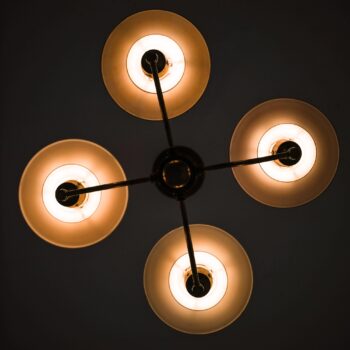 Ceiling lamp in browned brass and glass at Studio Schalling