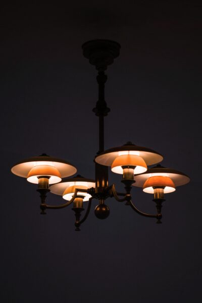 Ceiling lamp in browned brass and glass at Studio Schalling