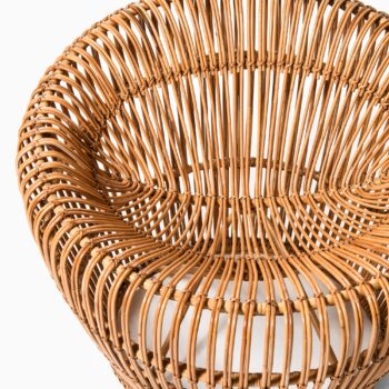Easy chair in rattan, cane and fabric at Studio Schalling