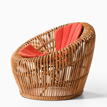 Easy chair in rattan, cane and fabric at Studio Schalling