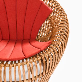 Easy chair in rattan, cane and fabric at Studio Schalling