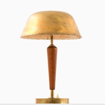 Table lamp in brass and beech at Studio Schalling