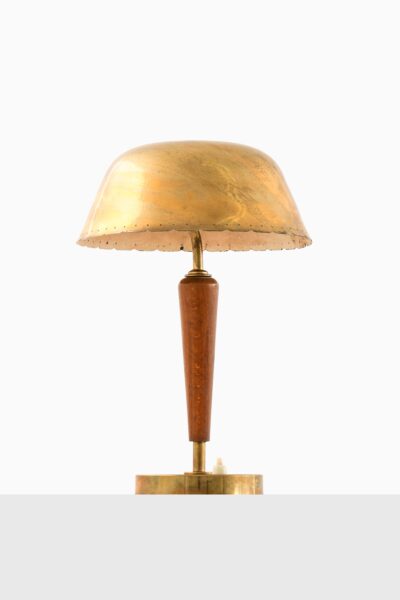 Table lamp in brass and beech at Studio Schalling