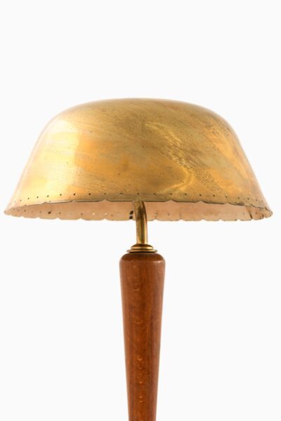 Table lamp in brass and beech at Studio Schalling