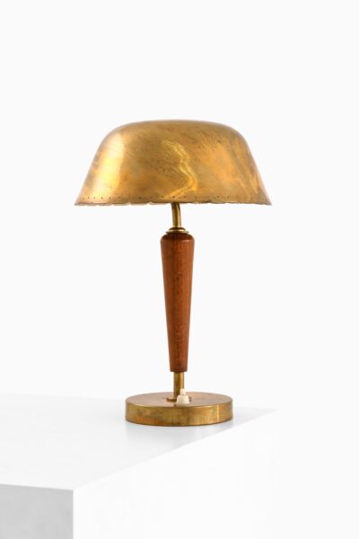 Table lamp in brass and beech at Studio Schalling