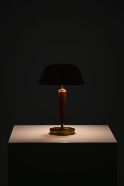 Table lamp in brass and beech at Studio Schalling