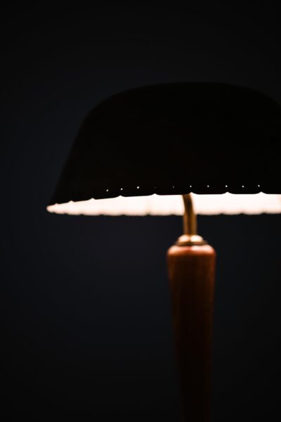 Table lamp in brass and beech at Studio Schalling