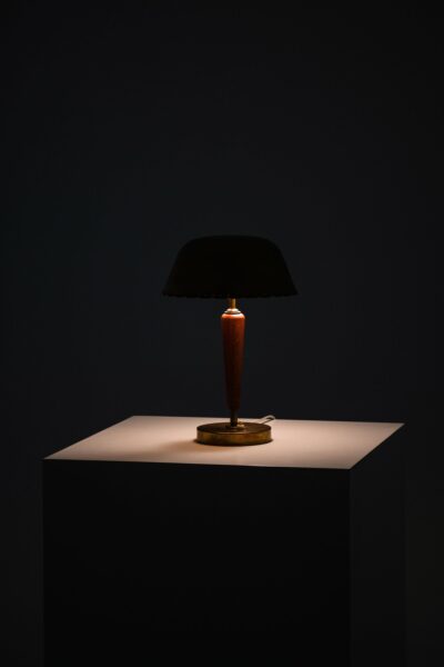 Table lamp in brass and beech at Studio Schalling