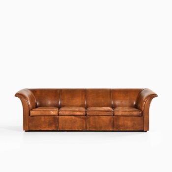 Sofa in niger leather and beech at Studio Schalling