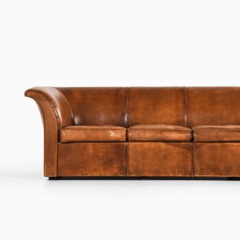 Sofa in niger leather and beech at Studio Schalling