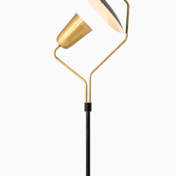 Floor lamp in black lacquered metal and brass at Studio Schalling