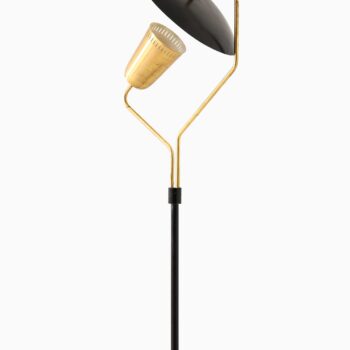 Floor lamp in black lacquered metal and brass at Studio Schalling