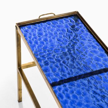 Side / tray table in brass and glass at Studio Schalling