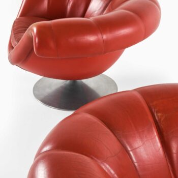 Easy chairs in aluminium and red leather at Studio Schalling