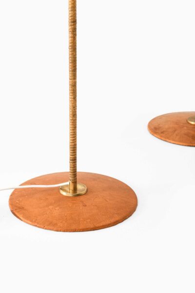 Floor lamps in leather and cane at Studio Schalling