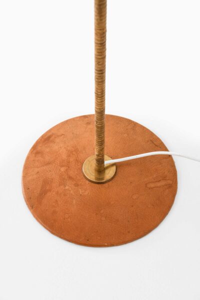 Floor lamps in leather and cane at Studio Schalling